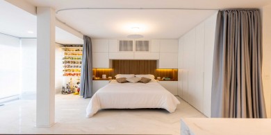 一個小公寓的改造，利用窗簾裝飾一個開放式臥室