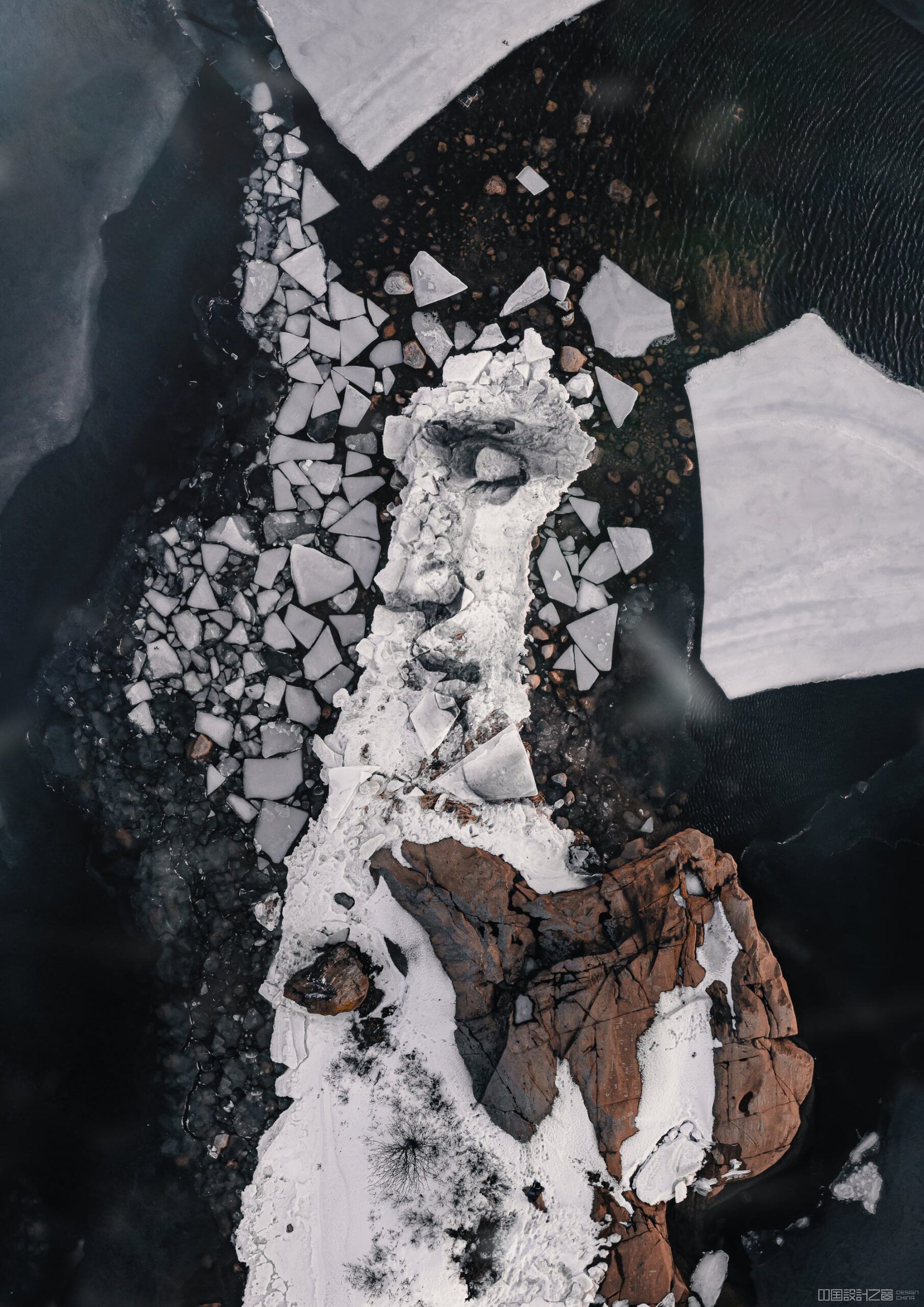 A portrait of a man is rendered on a fractured ice floe